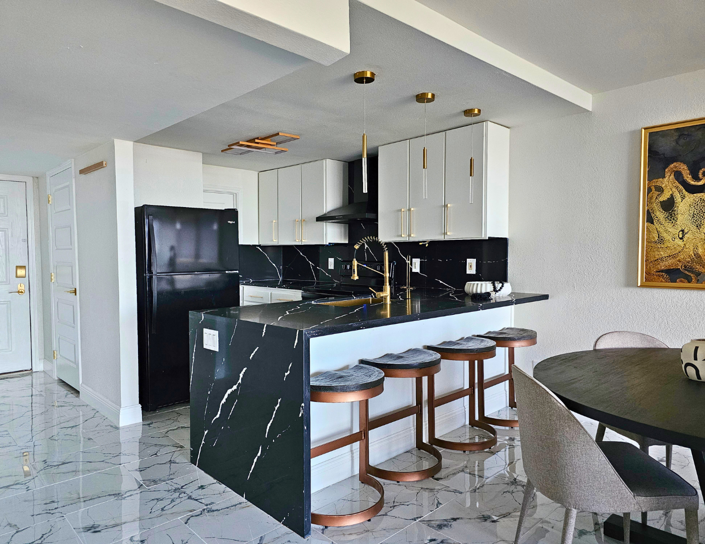 Contemporary beach condo kitchen designed by League City interior designer Diva by Design with clean lines and a calm, cohesive feel