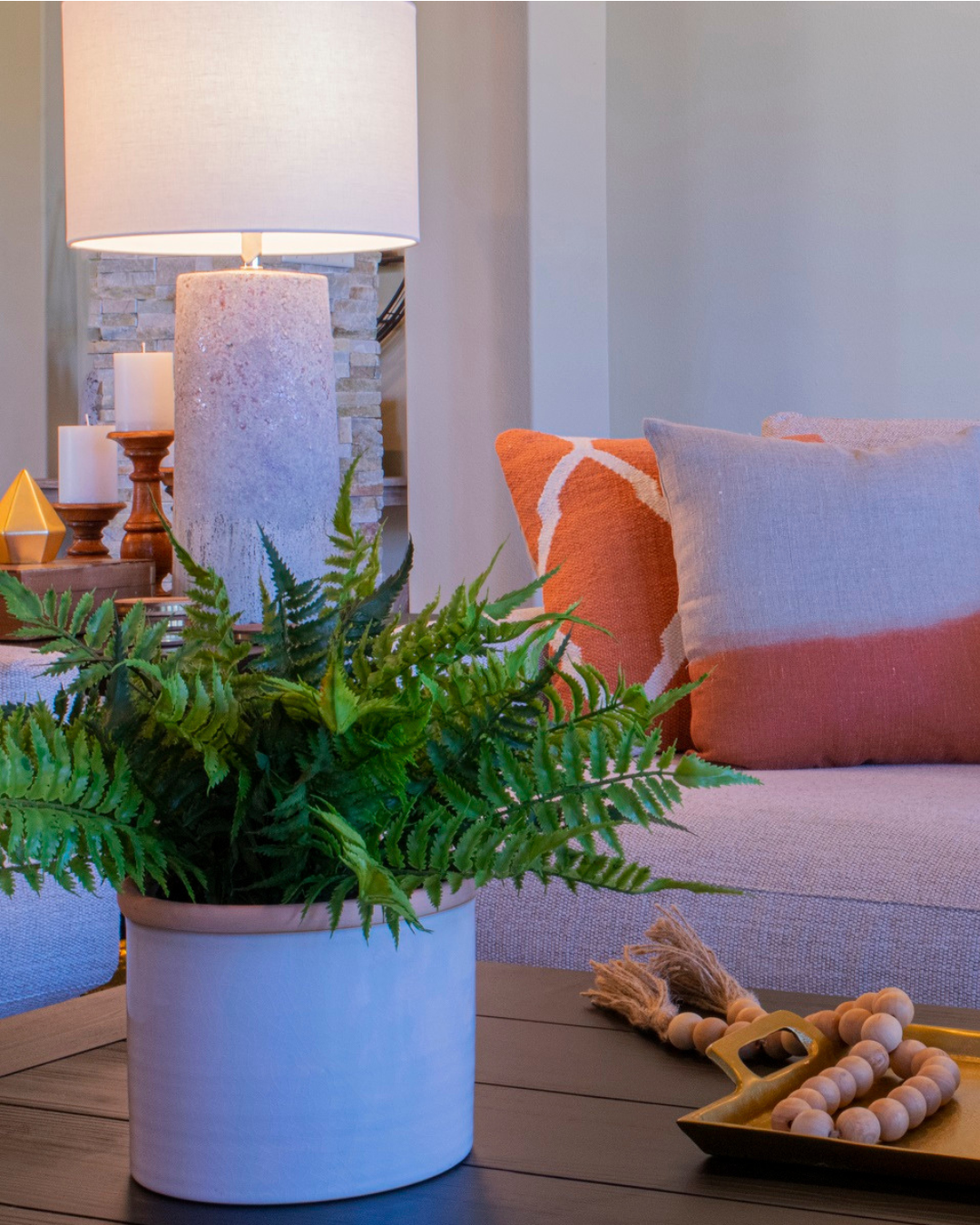 Thoughtfully designed living room with warm lighting, comfortable seating, and intentional styling that creates a welcoming atmosphere