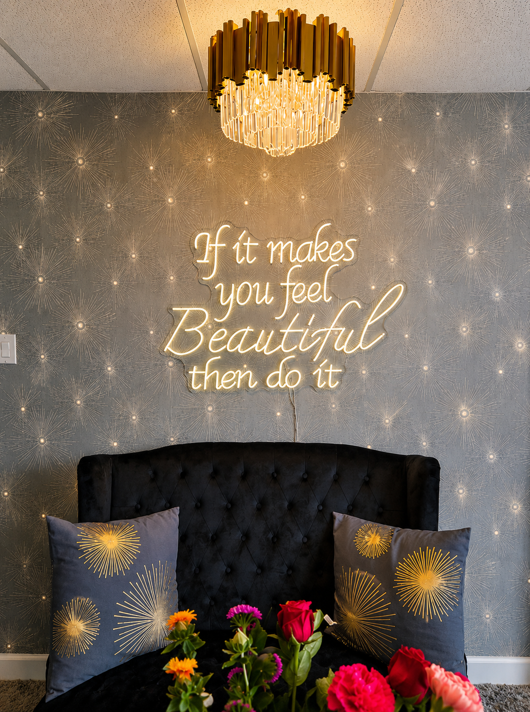 neon wall sign and modern gold chandelier with black sofa 
