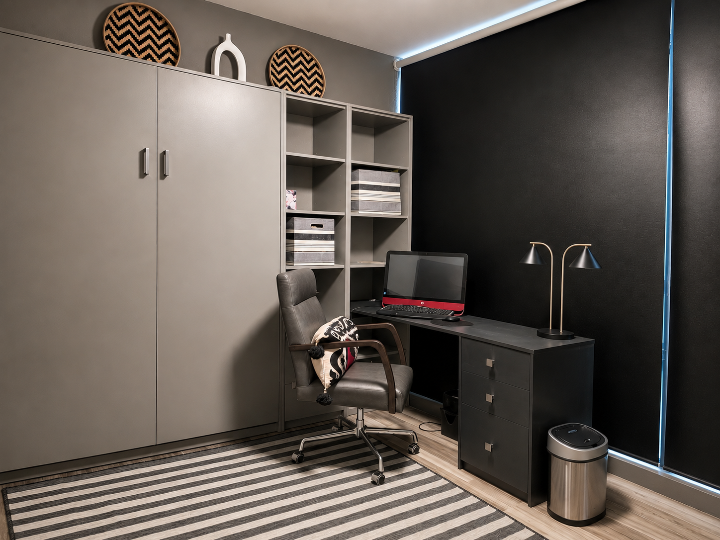 Modern coastal guest room with a custom Murphy bed, built-in shelving, integrated desk, and contemporary workspace designed for multifunctional beach condo living