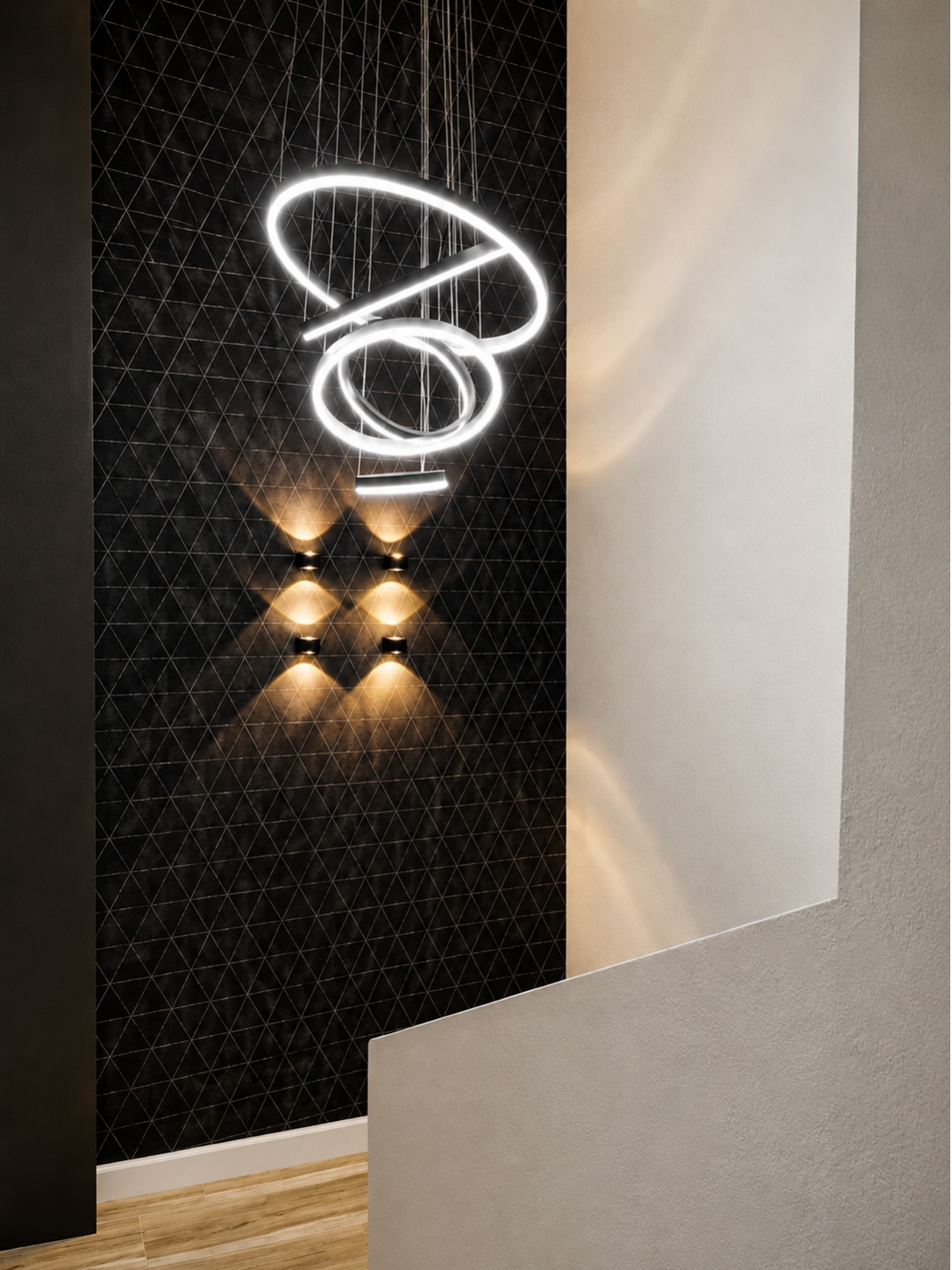 Modern staircase with warm wood-look steps leading to a black geometric accent wall featuring sculptural pendant lighting and contemporary wall sconces in a luxury coastal condo