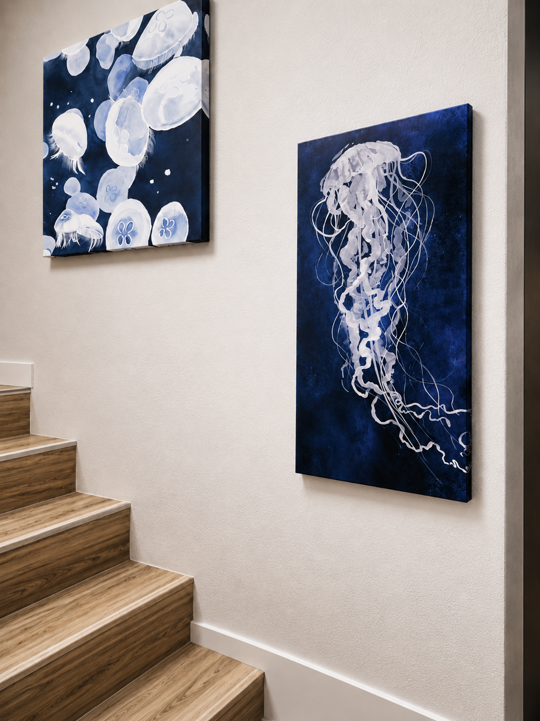 Modern coastal staircase with light blond wood-look stairs and blue jellyfish artwork creating a serene gallery wall in a bright contemporary condo interior